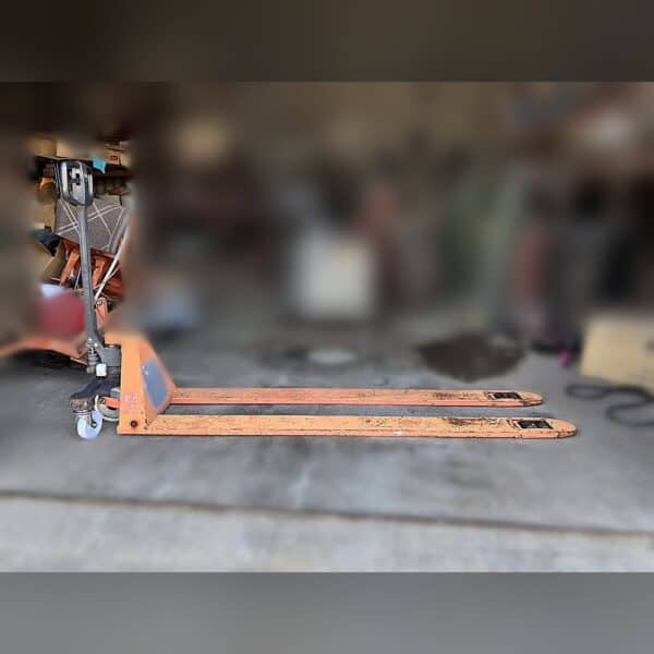 BT Toyota LHM100UL ultra-low pallet jack with 79-inch extra-long forks on a shop floor